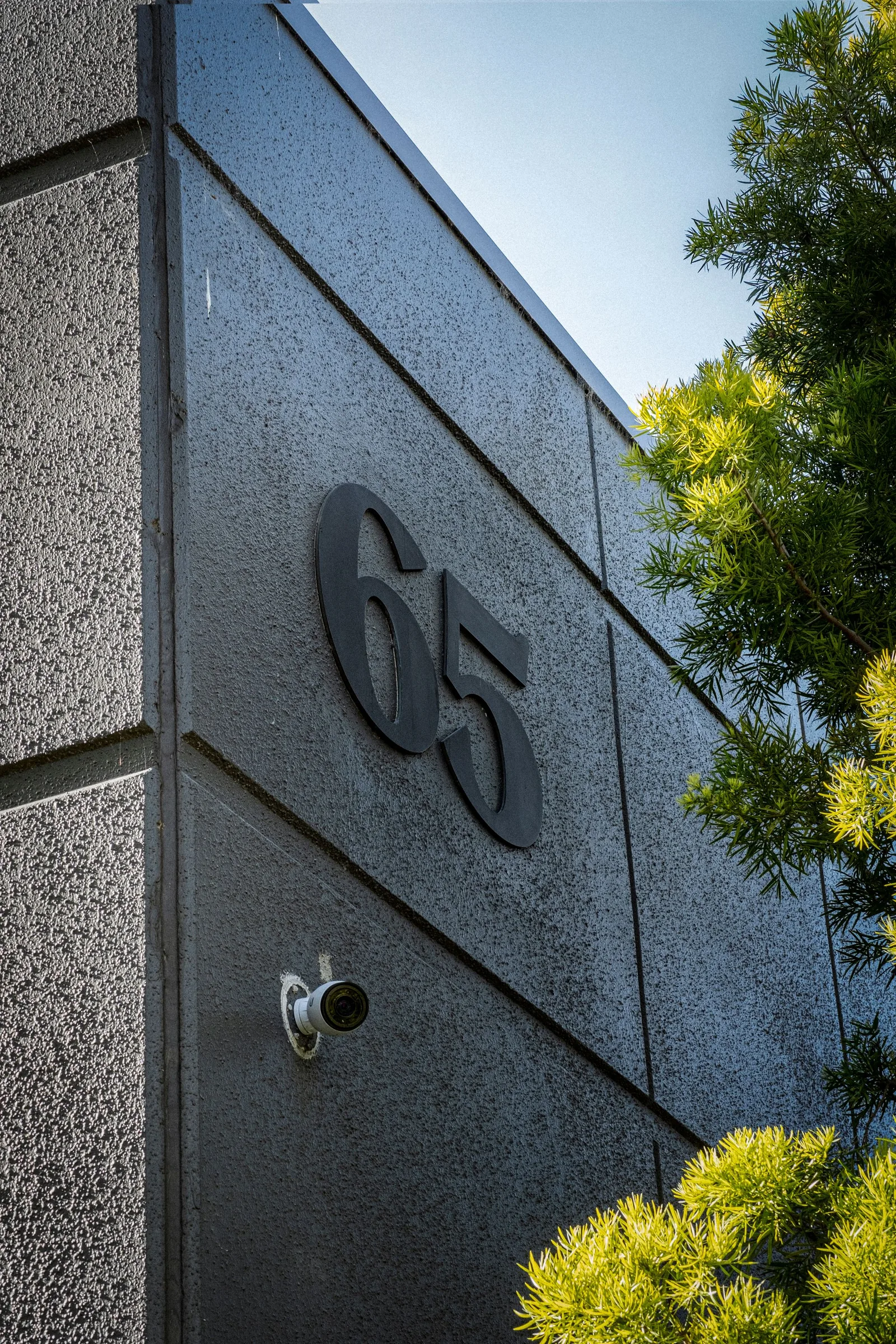 Commercial building exterior with security camera in Midrand corridor